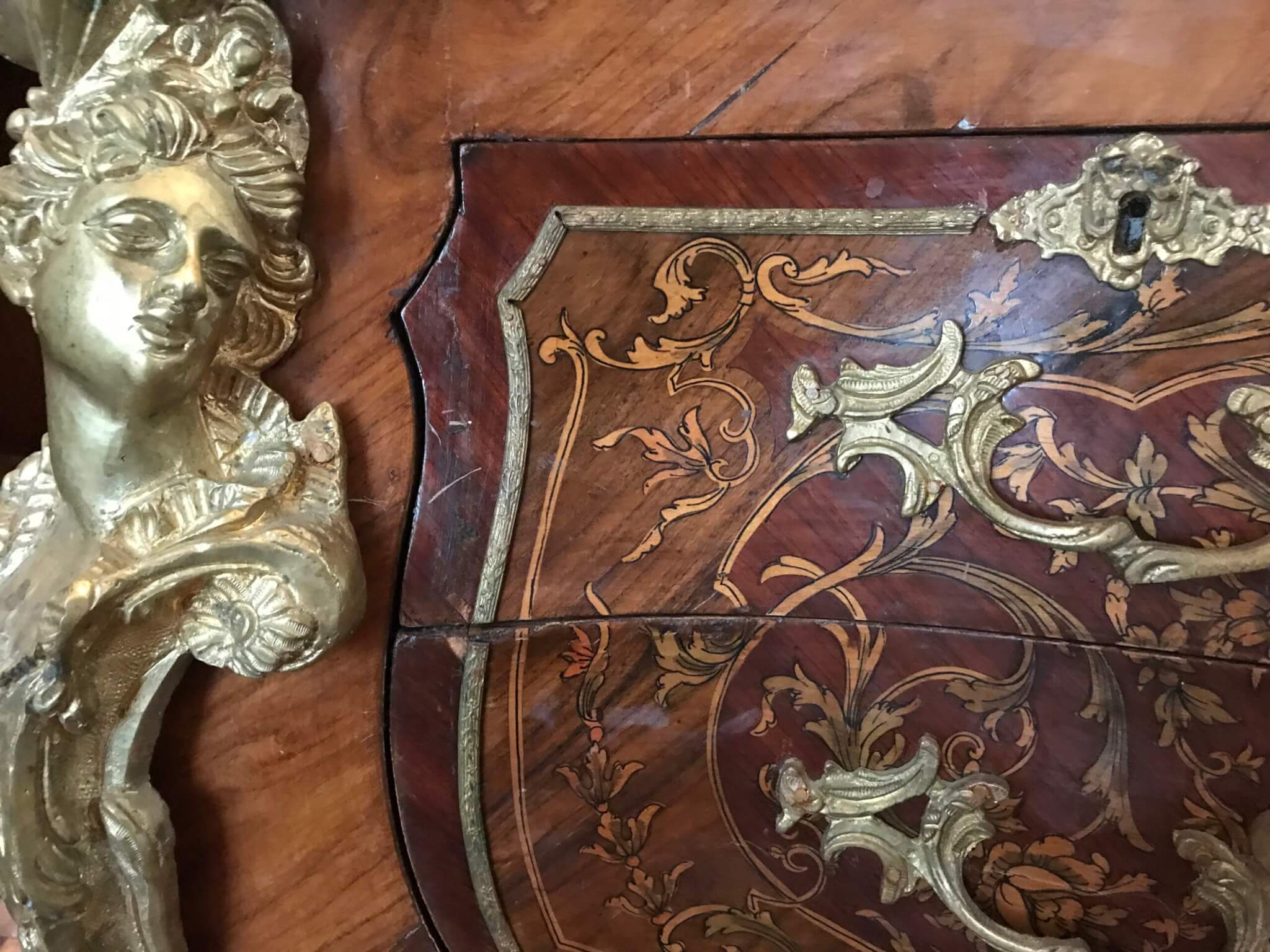 Detail of a French dresser with inlay and ormolu