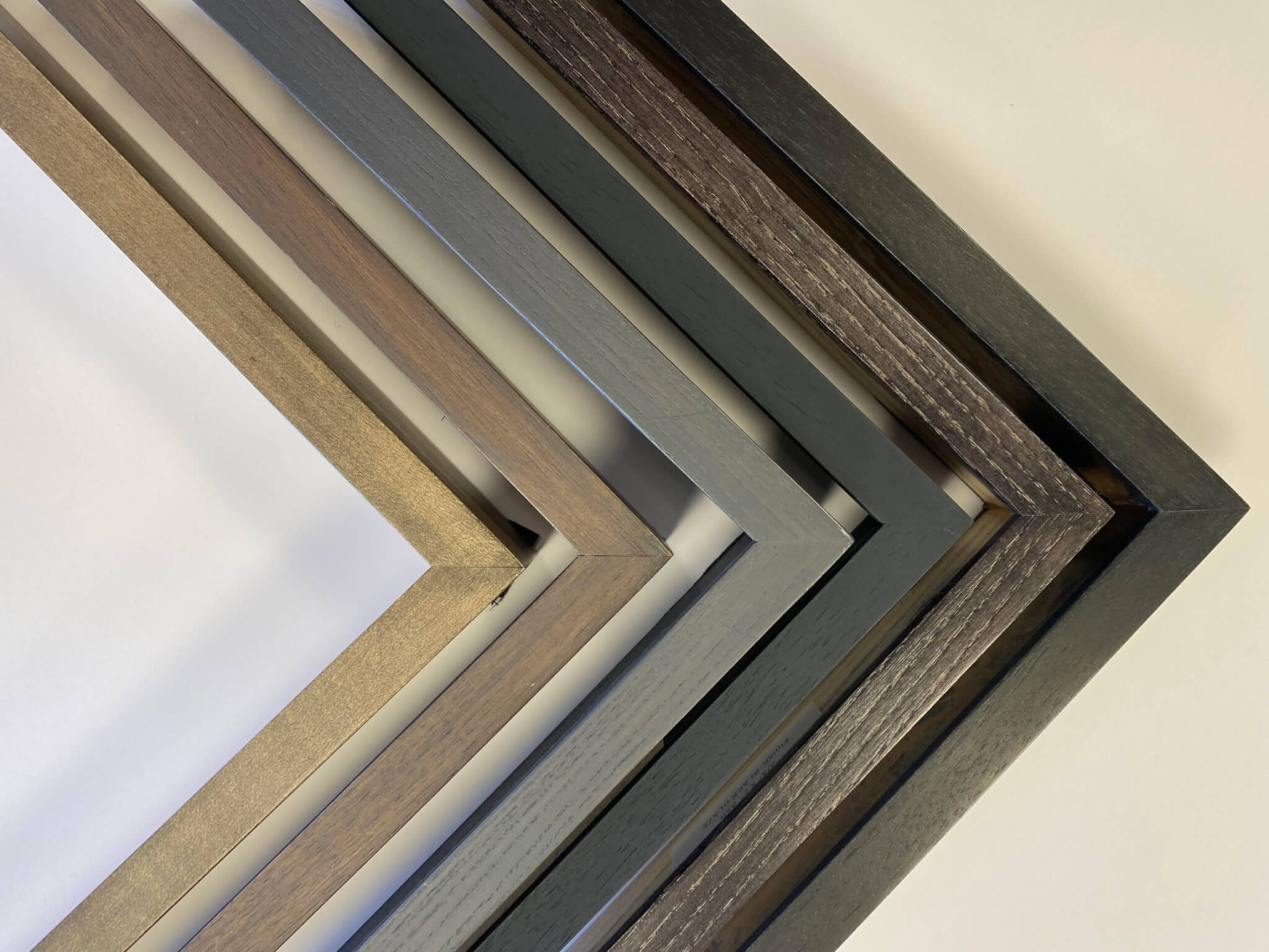 Collection of black finished custom corner gallery frames