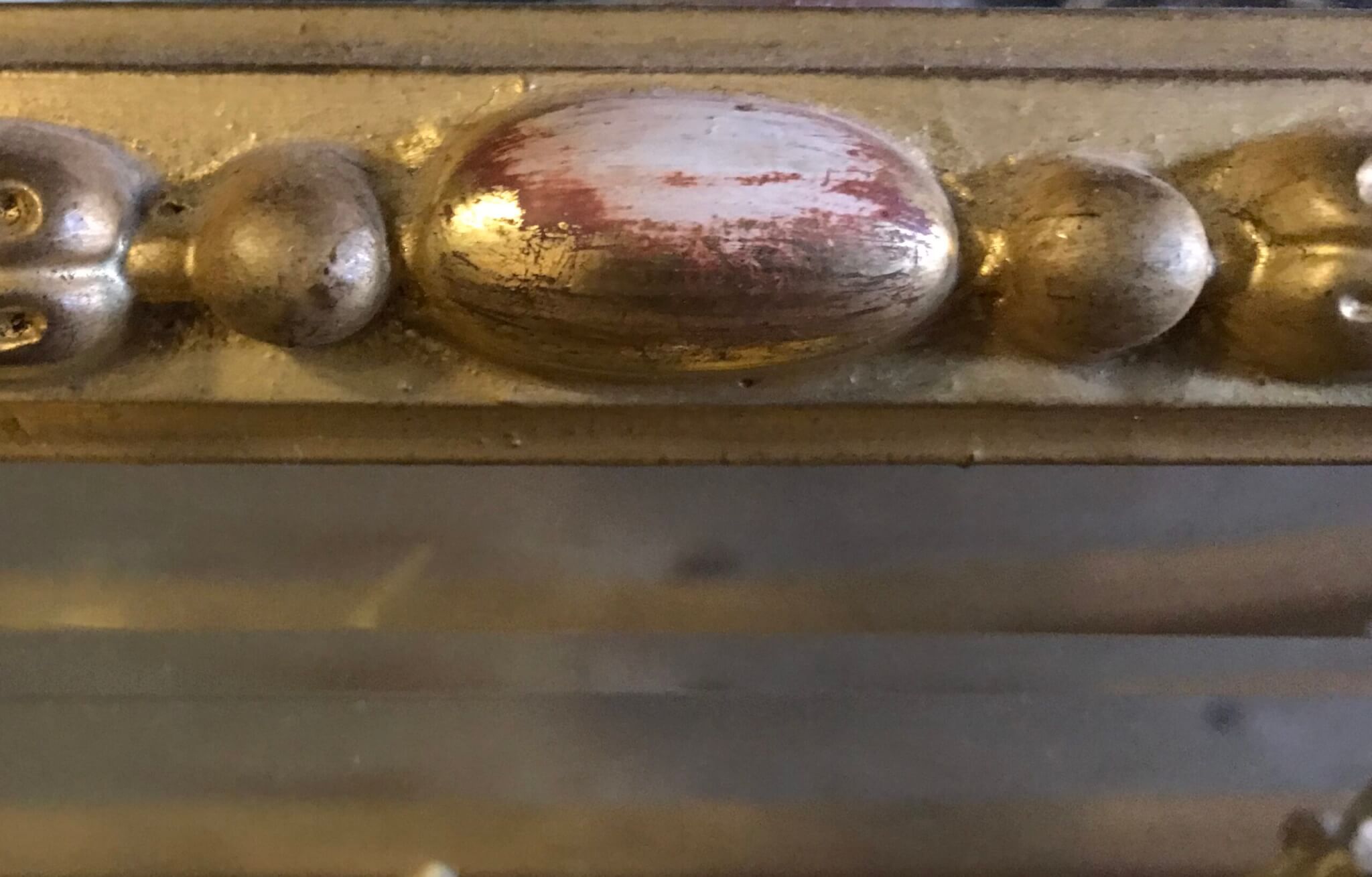 Gilded Frame ornamentation that has been overcleaned.  Frame conservation frame restoration frame repair gold leaf gilding repair