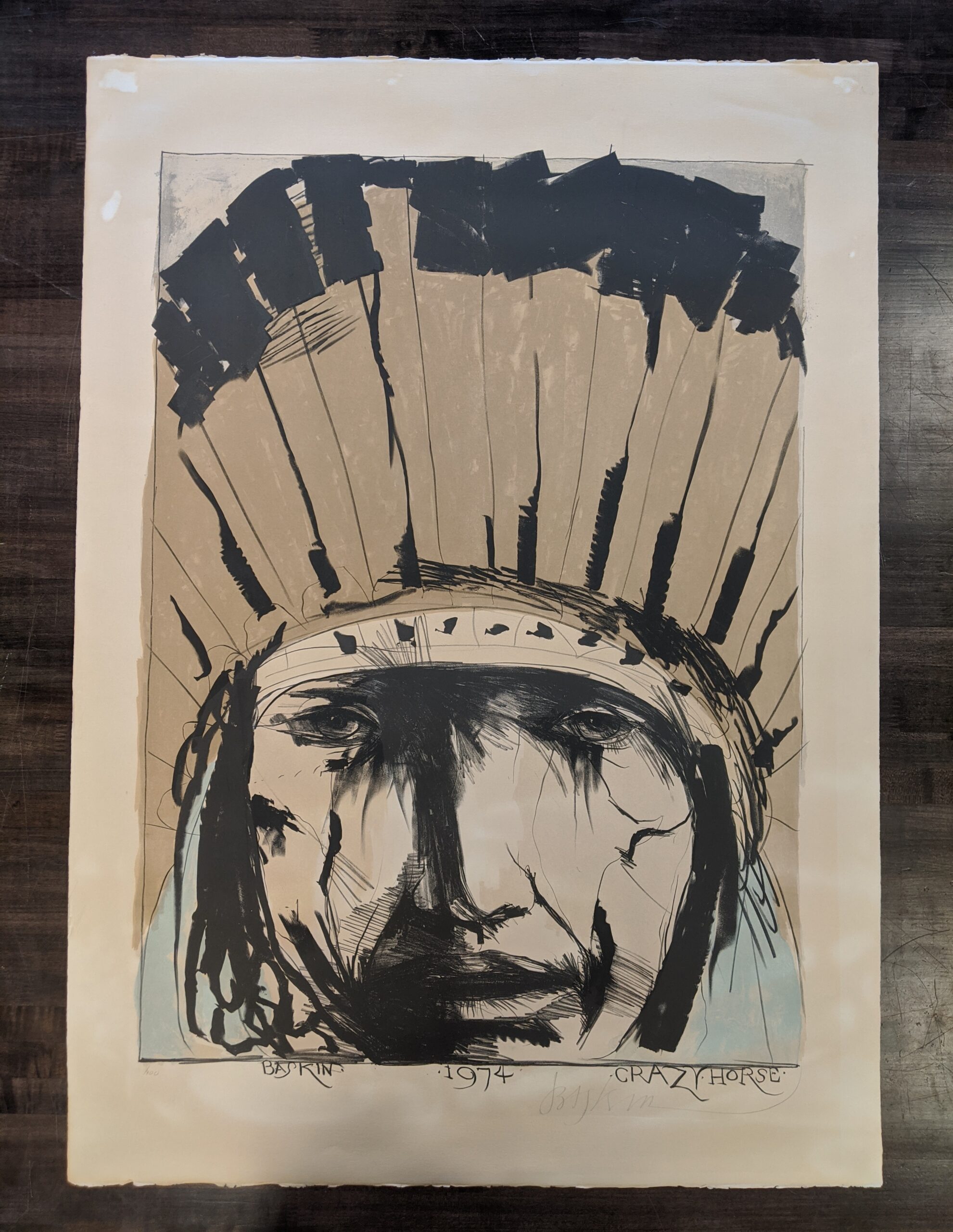 Sioux Green Oval by Leonard Baskin before treatment. The sheet is severely discolored. Color lithograph on paper.