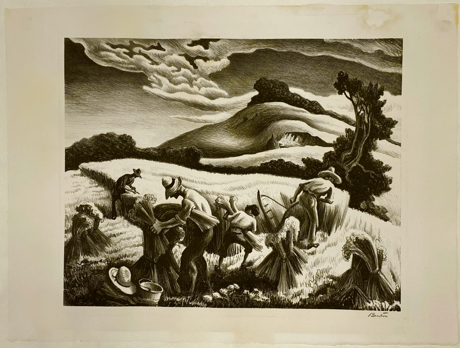 A Thomas Hart Benton lithograph entitled Cradling Wheat from 1939 on white wove paper depicting farmers working in a field of wheat with a background of hills, trees and sky showing water damage with staining and distortion before conservation treatment