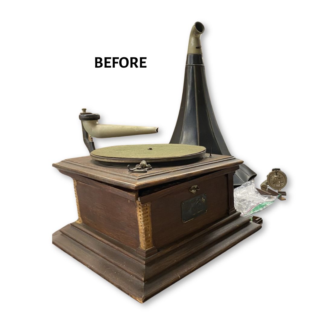 An antique phonograph broken into several pieces