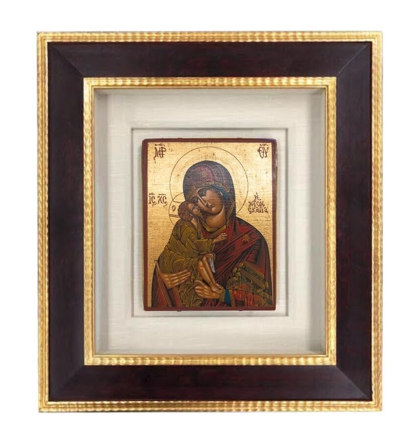 A museum quality shadowbox frame with 22k real gold leaf and a burl wood veneer panel frame for an antique virgin mary and child icon