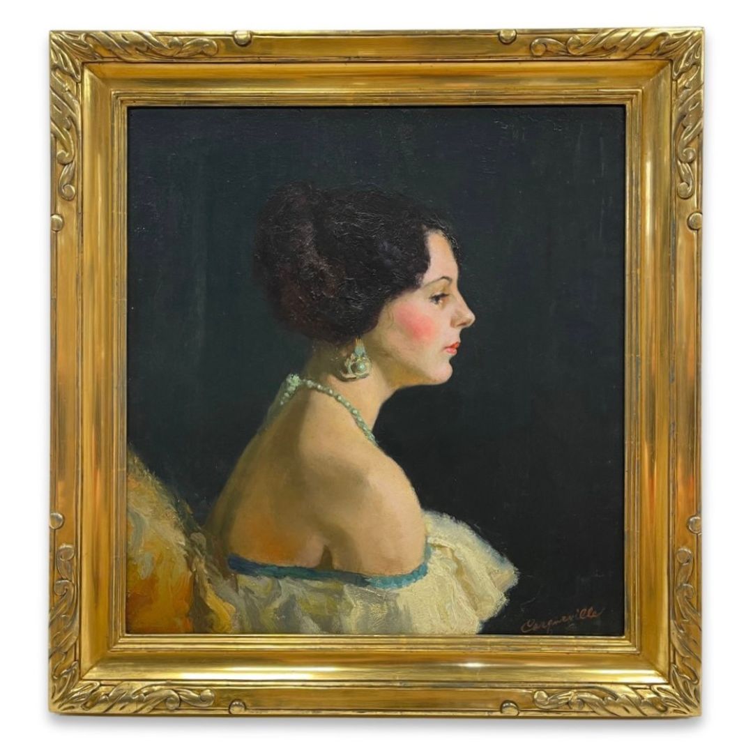 An oil painting portrait of a woman in profile from the 1930s, with an off the shoulder dress. Custom framed in a hand made authentic gold leaf frame with hand carved detail.