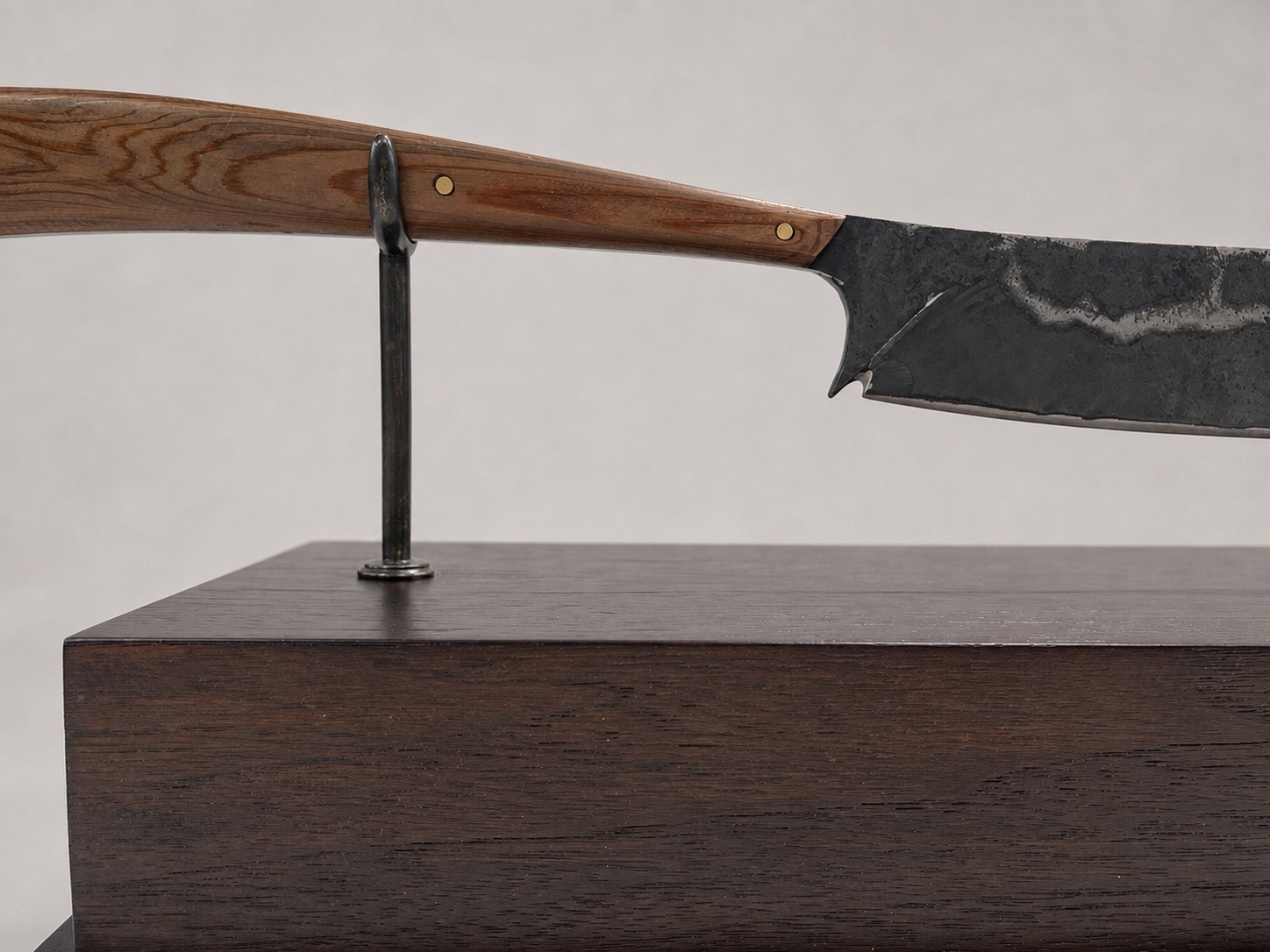 Close-up of the hand-calligraphed, 22-karat gold leaf nameplate on the champagne saber mount