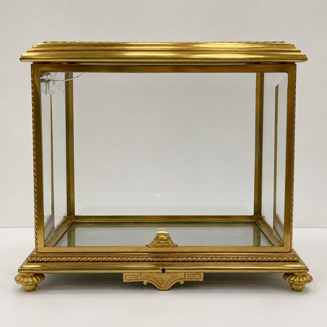 Antique brass tantalus with broken beveled glass panel, front view before restoration