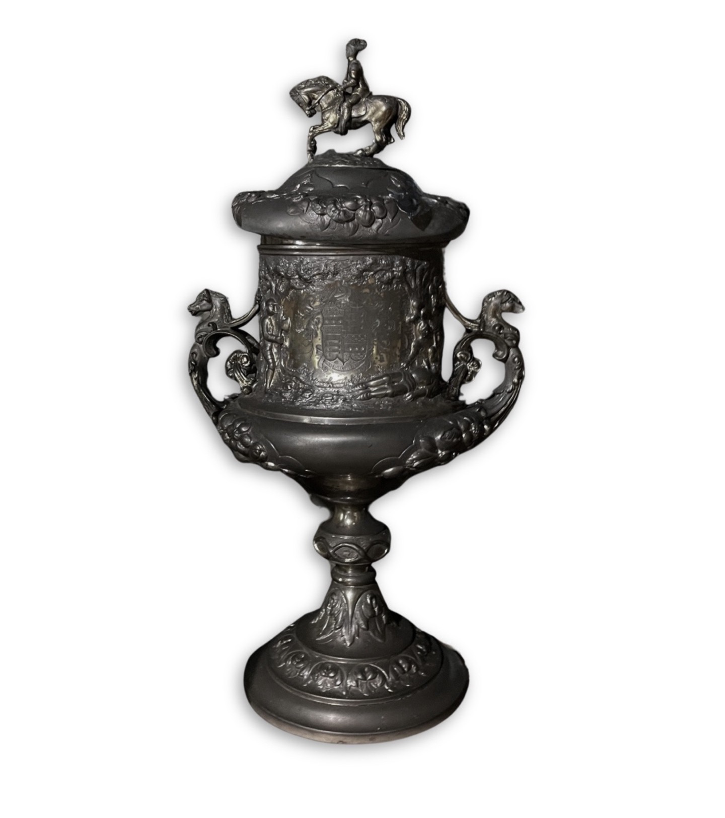 Antique silver trophy cup with equestrian finial and coat of arms, heavily tarnished and coated in soot before fire damage restoration