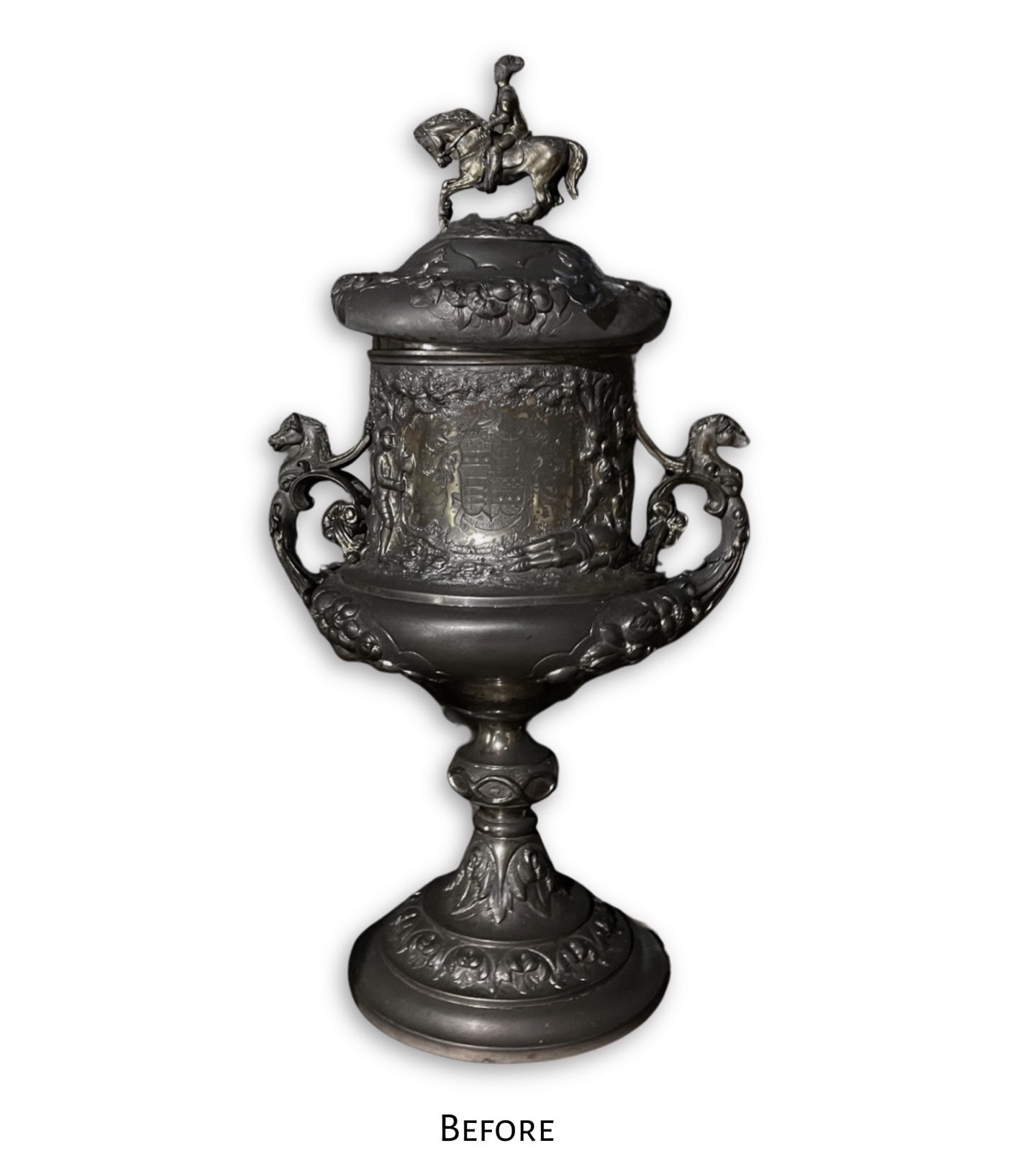 BEFORE: Antique silver trophy cup with equestrian finial and coat of arms, heavily tarnished and coated in soot before fire damage restoration